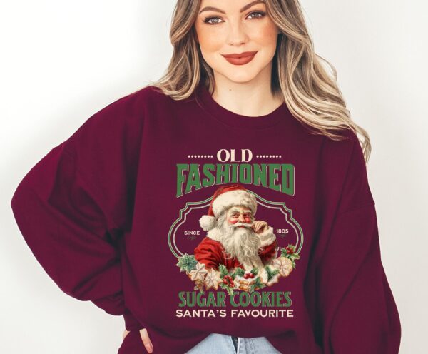 vintage christmas sweatshirt featuring santa claus and sugar cookies for a retro holiday look 9up19