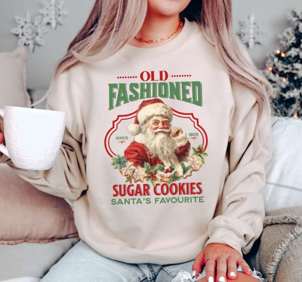 vintage christmas sweatshirt featuring santa claus and sugar cookies for a retro holiday look pnc86