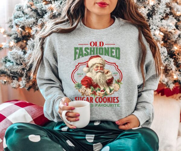 vintage christmas sweatshirt featuring santa claus and sugar cookies for a retro holiday look tnr26