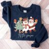 vintage christmas sweatshirt featuring santa claus design for holiday celebrations and festive events zc3iv