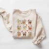 vintage christmas sweatshirt featuring santas reindeer names for kids funny holiday tee with unique design agokk scaled