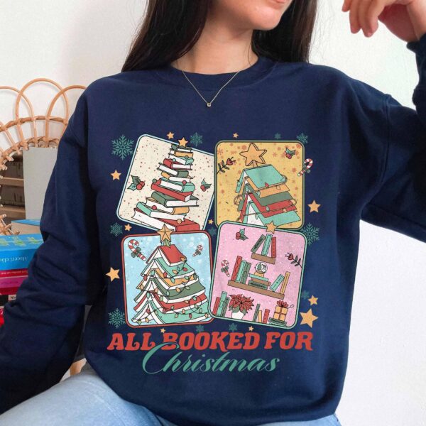 vintage christmas sweatshirt for book lovers featuring a christmas book tree design ideal for librarians and bookworms bzlyq