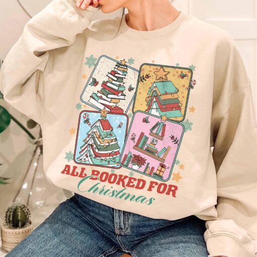 vintage christmas sweatshirt for book lovers featuring a christmas book tree design ideal for librarians and bookworms osclw