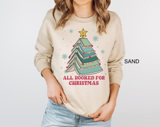 vintage christmas sweatshirt for book lovers featuring books and christmas tree design perfect for holiday gatherings pakkc