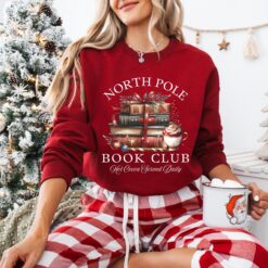 vintage christmas sweatshirt for book lovers featuring north pole book club design and retro santa graphic for holiday celebrations 9zpsn scaled