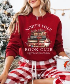 vintage christmas sweatshirt for book lovers featuring north pole book club design and retro santa graphic for holiday celebrations 9zpsn scaled