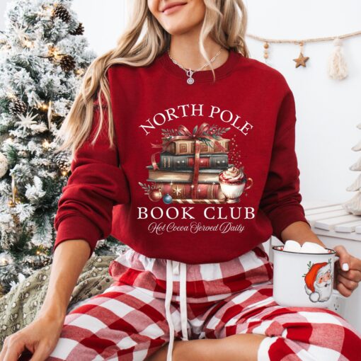 vintage christmas sweatshirt for book lovers featuring north pole book club design and retro santa graphic for holiday celebrations 9zpsn scaled