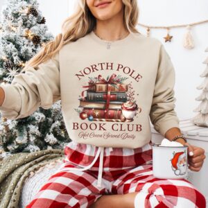 vintage christmas sweatshirt for book lovers featuring north pole book club design and retro santa graphic for holiday celebrations uxrcp