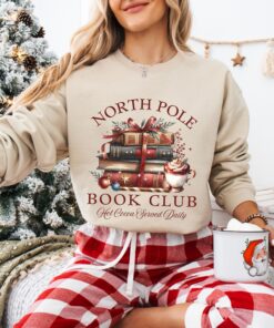 vintage christmas sweatshirt for book lovers featuring north pole book club design and retro santa graphic for holiday celebrations uxrcp scaled