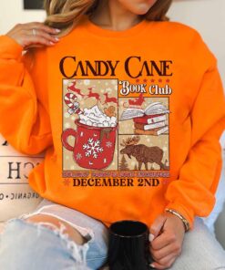 vintage christmas sweatshirt for book lovers with candy cane design and santa theme ideal for winter book club gatherings mzkrh