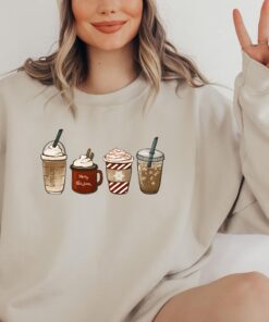 vintage christmas sweatshirt for coffee lovers featuring snowman and latte design ideal for winter wear yt89y scaled