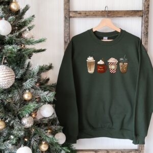 vintage christmas sweatshirt for coffee lovers featuring snowman design and winter latte theme ucsg2