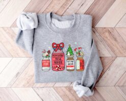 vintage christmas sweatshirt for healthcare workers featuring snowman design ideal for pharmacists and pharmacy technicians 7klpn scaled