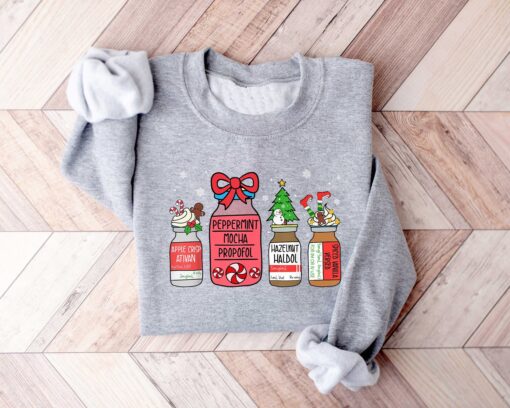 vintage christmas sweatshirt for healthcare workers featuring snowman design ideal for pharmacists and pharmacy technicians 7klpn scaled