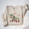 vintage christmas sweatshirt for plant lovers featuring cute ghost design and tree graphics 0f3ph scaled