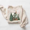 vintage christmas sweatshirt for women featuring a fun christmas house design and cookie print for holiday celebrations lflsn