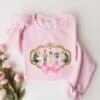 vintage christmas sweatshirt for women featuring pink nutcracker design comfortable and stylish long sleeve shirt for holiday wear ayc7r