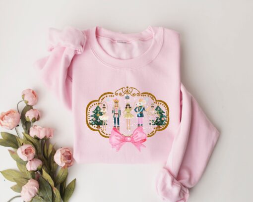 vintage christmas sweatshirt for women featuring pink nutcracker design comfortable and stylish long sleeve shirt for holiday wear ayc7r