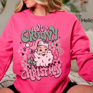 vintage christmas sweatshirt for women featuring retro santa design in pink for a groovy holiday look 06rdl