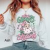 Vintage Christmas Sweatshirt for Women featuring Retro Santa Design in Pink for a Groovy Holiday Look