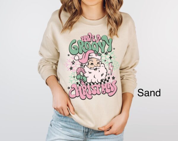 vintage christmas sweatshirt for women featuring retro santa design in pink for a groovy holiday look ov26r