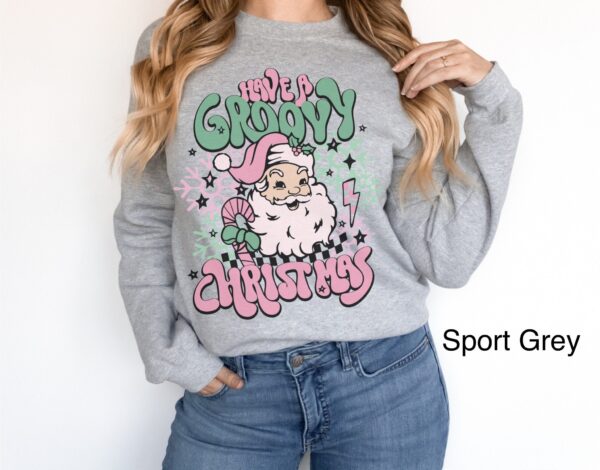 vintage christmas sweatshirt for women featuring retro santa design in pink for a groovy holiday look p1vpp