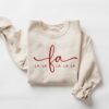 vintage christmas sweatshirt for women with fa la la design comfortable crewneck style for holiday outfits and festive celebrations jymho