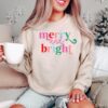 vintage christmas sweatshirt for women with merry and bright design ideal for family gatherings and holiday celebrations nhvwe scaled