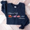 vintage christmas sweatshirt i believe in santa and dinosaurs funny design with dino reindeers for dinosaur lovers etfal scaled