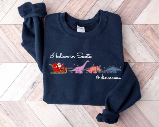 vintage christmas sweatshirt i believe in santa and dinosaurs funny design with dino reindeers for dinosaur lovers etfal scaled