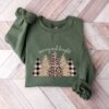 vintage christmas sweatshirt merry and bright tree design with leopard pattern for halloween and holiday celebrations ahgfz scaled