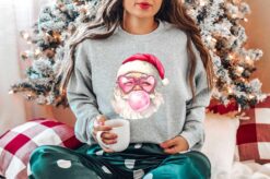 Vintage Christmas Sweatshirt Santa Blowing Bubble Gum Retro Design Pink Colorful Long Sleeve Shirt for Holiday Celebrations
