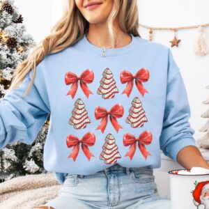 vintage christmas sweatshirt with bow design and christmas tree cake graphic for trendy holiday apparel 0qn0a