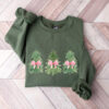 vintage christmas sweatshirt with bow design and tree print in comfort colors for a girly look oma0x