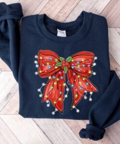 vintage christmas sweatshirt with bow design for retro holiday style and festive vibes cgueg scaled