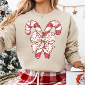 vintage christmas sweatshirt with candy cane design for christmas squad crewneck and pink christmas style 8iotw