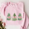 vintage christmas sweatshirt with coquette bow design and tree print for women ideal for holiday gatherings and festive celebrations ugv9g scaled