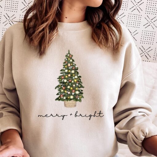 vintage christmas sweatshirt with merry and bright design featuring a christmas tree for holiday comfort in winter crewneck style caqmi scaled