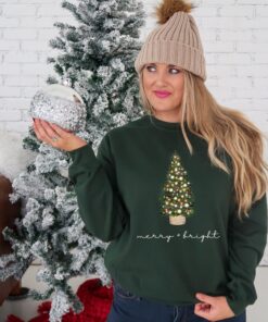 vintage christmas sweatshirt with merry and bright design featuring a christmas tree for holiday comfort in winter crewneck style fibvk scaled