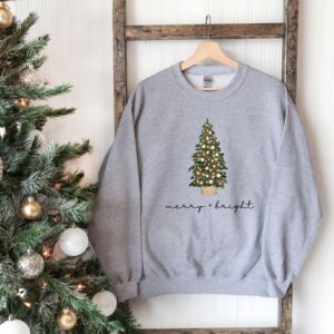 vintage christmas sweatshirt with merry and bright design featuring a christmas tree for holiday comfort in winter crewneck style ynfek