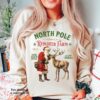 Vintage Christmas Sweatshirt with North Pole Reindeer Design Retro Style Long Sleeve Shirt for Holiday Celebrations