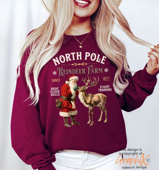 vintage christmas sweatshirt with north pole reindeer design retro style long sleeve shirt for holiday celebrations