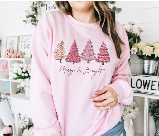 vintage christmas sweatshirt with pink christmas tree design and merry bright print for festive holiday style