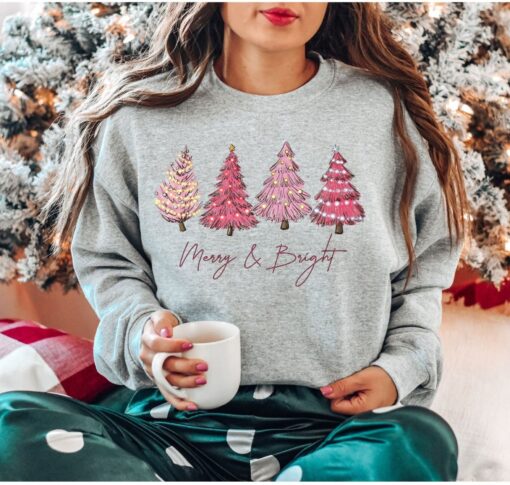 vintage christmas sweatshirt with pink christmas tree design and merry bright print for festive holiday style ro9qq