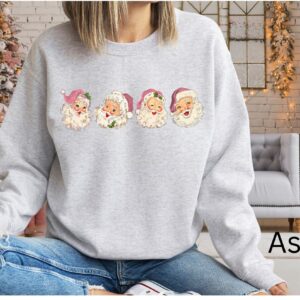 vintage christmas sweatshirt with pink santa claus design and retro style for a unique holiday look nvepz