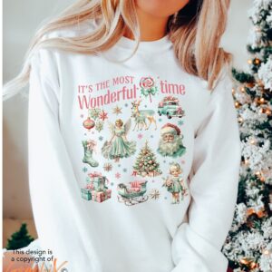 vintage christmas sweatshirt with retro pink design and fun doodle print for winter wear odqsn