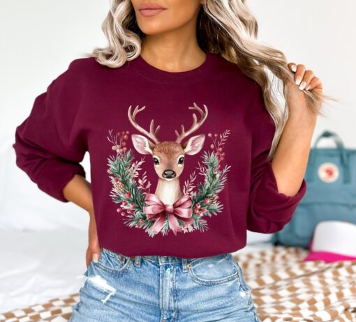 vintage christmas sweatshirt with retro pink reindeer design for women cute holiday apparel for festive celebrations