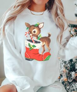 vintage christmas sweatshirt with retro reindeer design in pink cute baby deer shirt for holiday celebrations and festive gatherings nrebm