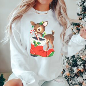 vintage christmas sweatshirt with retro reindeer design in pink cute baby deer shirt for holiday celebrations and festive gatherings nrebm