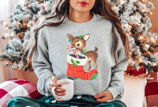 vintage christmas sweatshirt with retro reindeer design in pink cute baby deer shirt for holiday celebrations and festive gatherings u5nx0 scaled